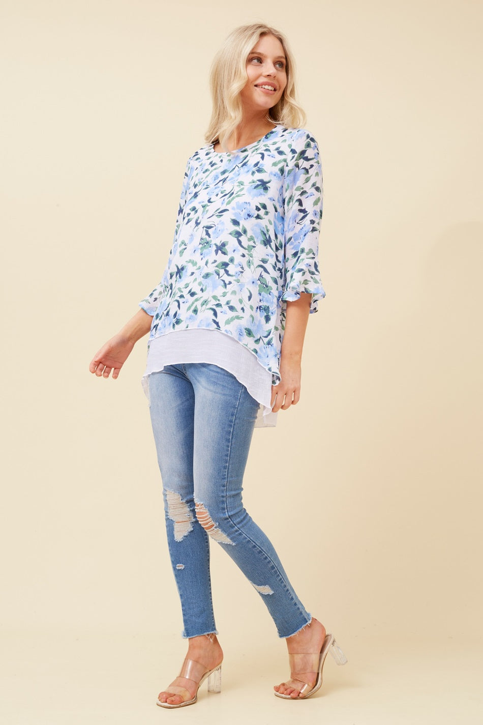 Image of a model wearing Tops. Product name - RUMI FLORAL DOUBLE LAYER TOP in Blue colour by brand - Caroline Morgan Australia
