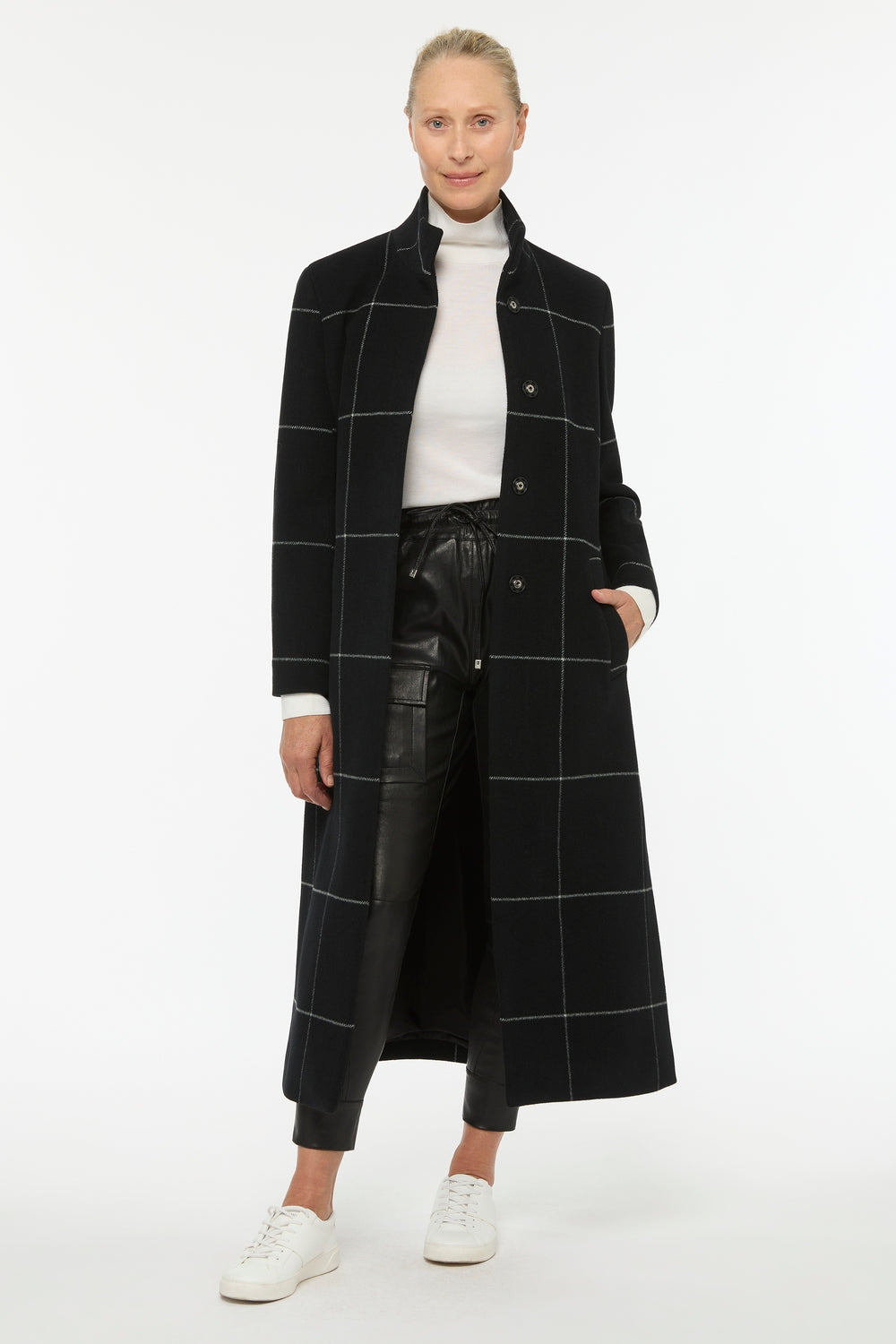 Image of a model wearing Outerwear. Productname: Windowpane Check Coat in Black Check colour by brand - Manning Cartell