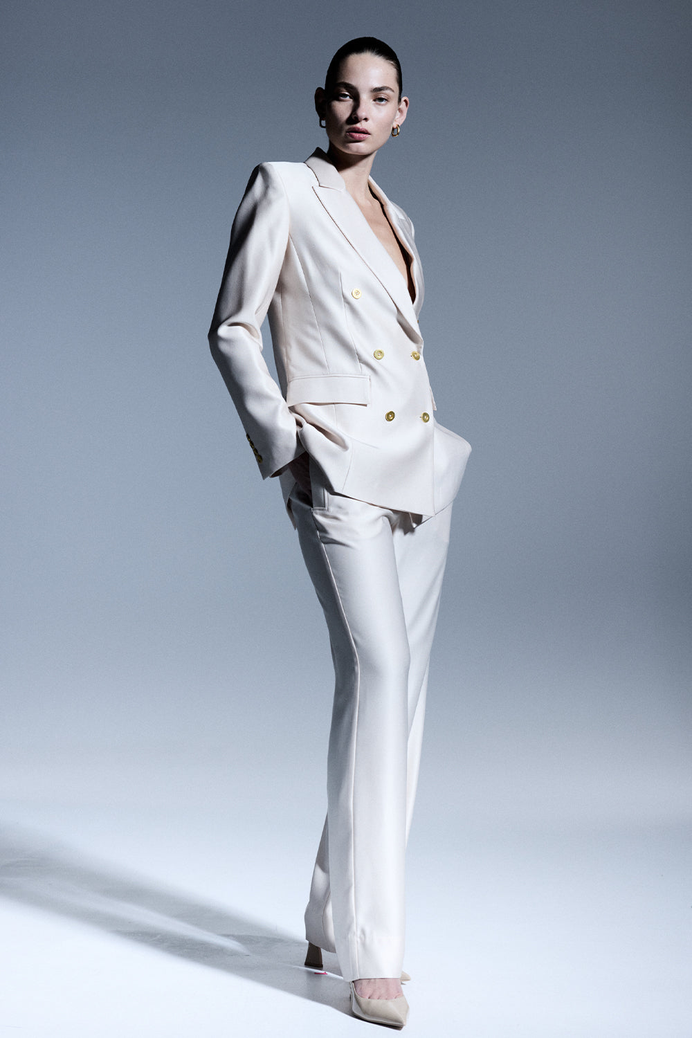 Image of a model wearing Pants. Productname: Neutral Stance Pant in Beige colour by brand - Manning Cartell