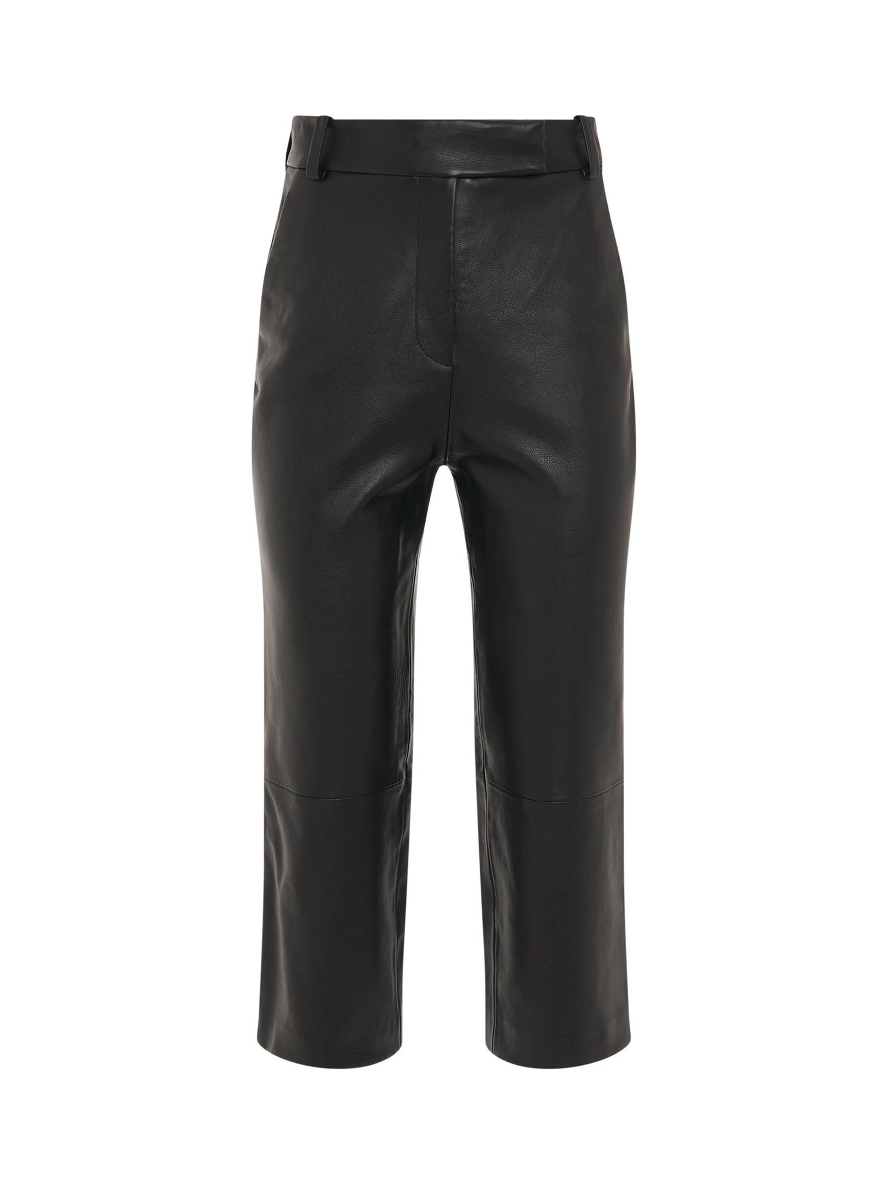 Image of a model wearing Pants. Productname: KHAITE Melie Pant in Black colour by brand - KHAITE