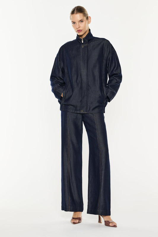 Image of a model wearing Outerwear. Productname: Quiet Command Bomber Jacket in Indigo colour by brand - Manning Cartell