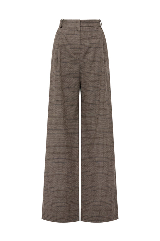 Image of a model wearing Pants. Product name - Tailor Made Pleat Pant in Brown colour by brand - MANNING CARTELL