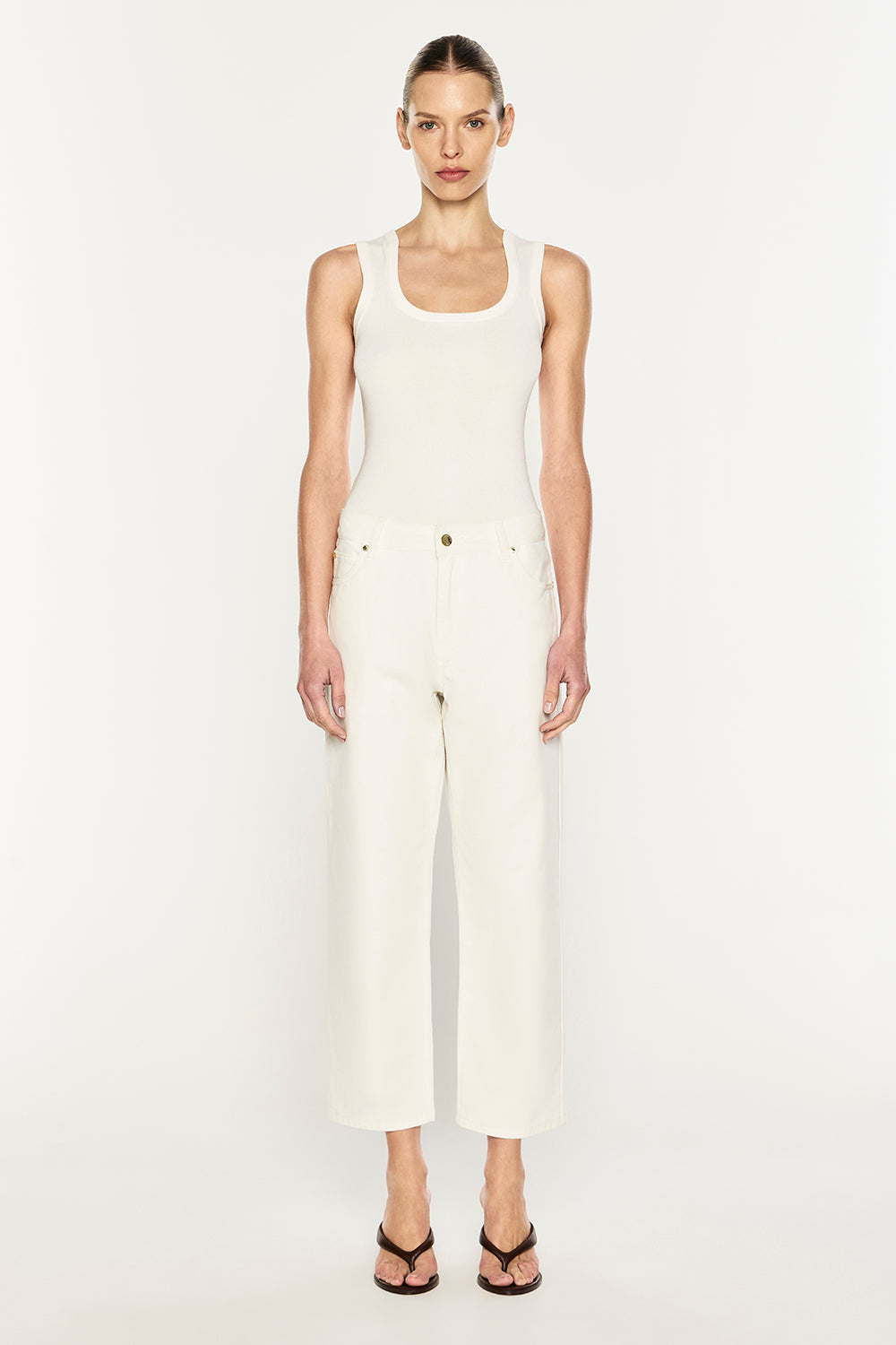 Image of a model wearing Pants. Product name - Clean Slate Crop Jean in Off White colour by brand - MANNING CARTELL