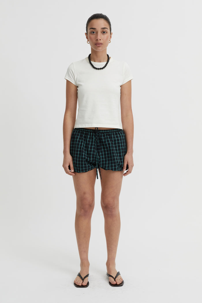 Image of a model wearing Shorts. Product name - Isley Shorts Black in Black colour by brand - Blanca Studio