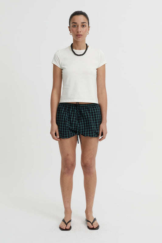 Image of a model wearing Shorts. Product name - Isley Shorts Black in Black colour by brand - Blanca Studio