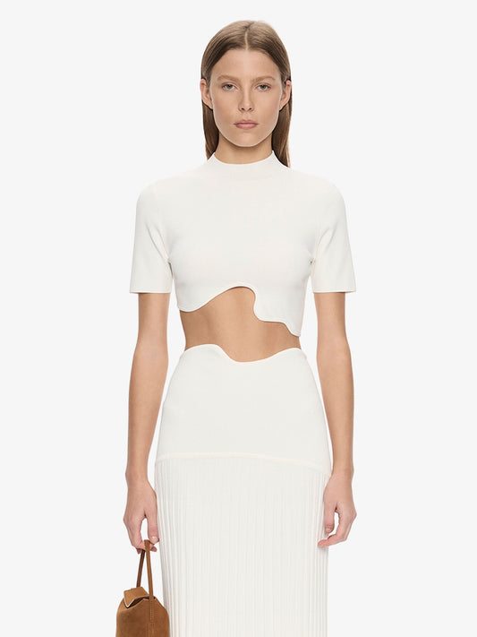 Image of a model wearing Tops. Product name - Maparadita Top in White colour by brand - CHRISTOPHER ESBER