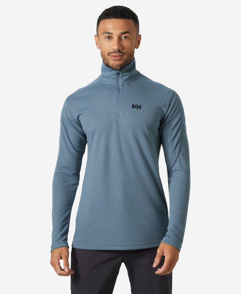 Image of a model wearing Outerwear. Product name - HP 1/2 ZIP PULLOVER 2.0, Washed Navy in Washed Navy colour by brand - Helly Hansen