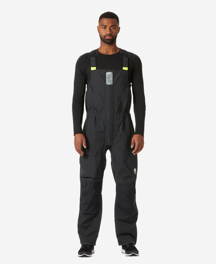 Image of a model wearing Pants. Product name - PIER BIB 4.0, Ebony in Ebony colour by brand - Helly Hansen
