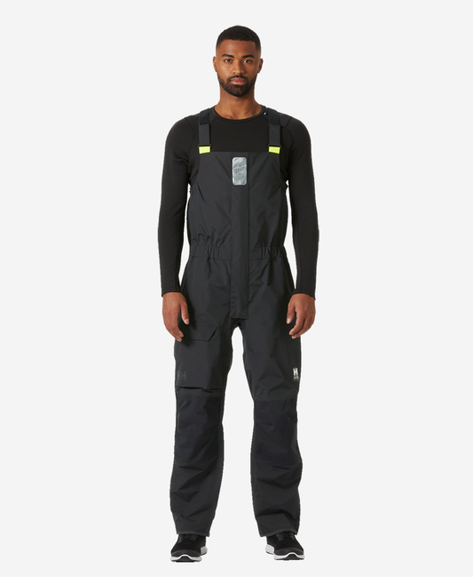 Image of a model wearing Pants. Product name - PIER BIB 4.0, Ebony in Ebony colour by brand - Helly Hansen