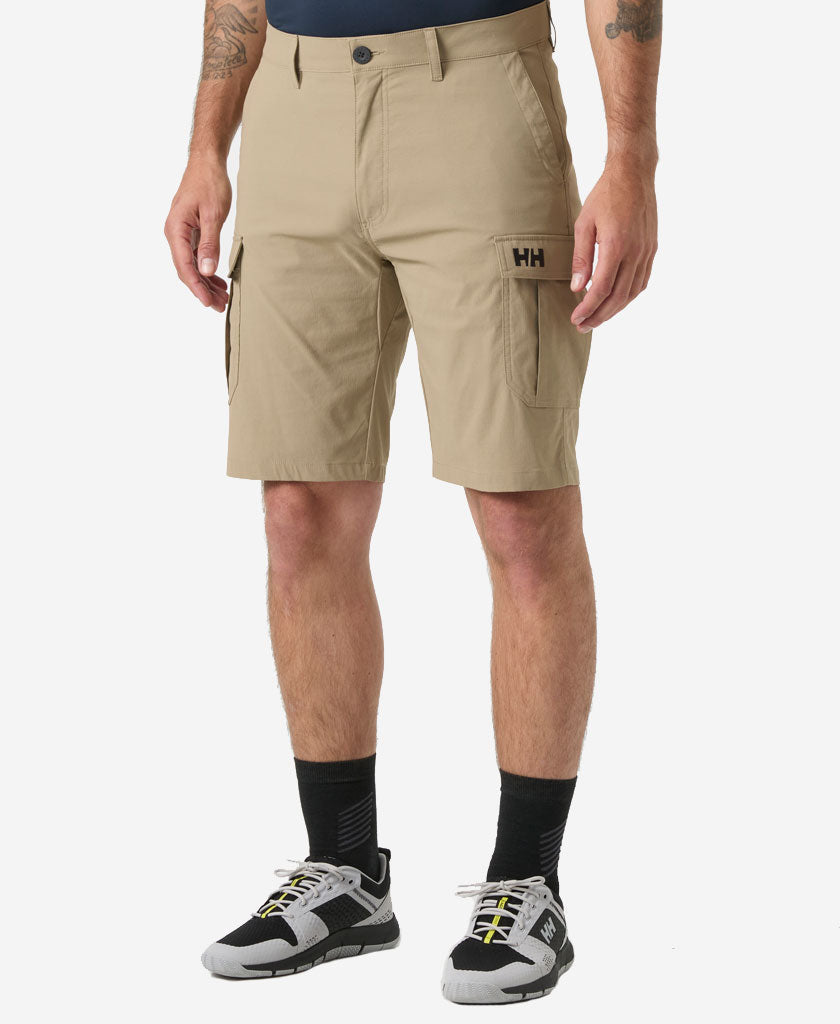 Image of a model wearing Shorts. Product name - HH QD CARGO SHORTS 11", Pebble in Pebble colour by brand - Helly Hansen