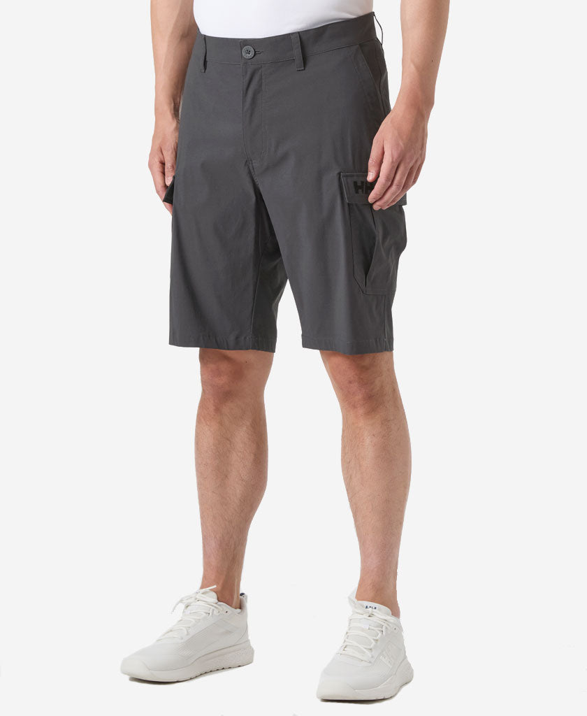 Image of a model wearing Shorts. Product name - HH QD CARGO SHORTS 11", Ebony in Ebony colour by brand - Helly Hansen