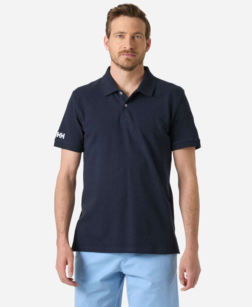 Image of a model wearing Tops. Product name - CREW POLO PIQUE, Navy in Navy colour by brand - Helly Hansen