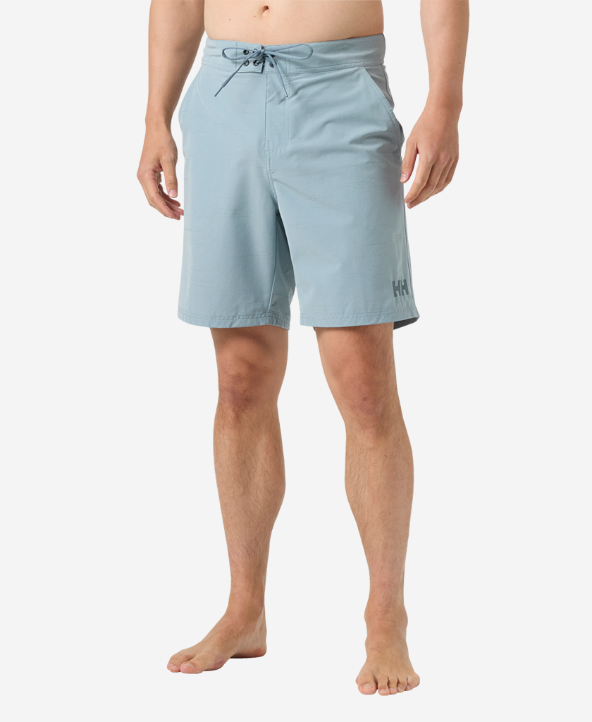 Image of a model wearing Shorts. Product name - NEWPORT BOARD SHORTS 8", Windy Blue in Windy Blue colour by brand - Helly Hansen