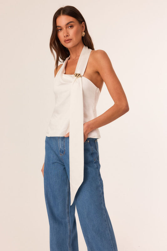 Image of a model wearing Tops. Productname: SNDYS ANISE HALTER TOP in Off White colour by brand - SNDYS