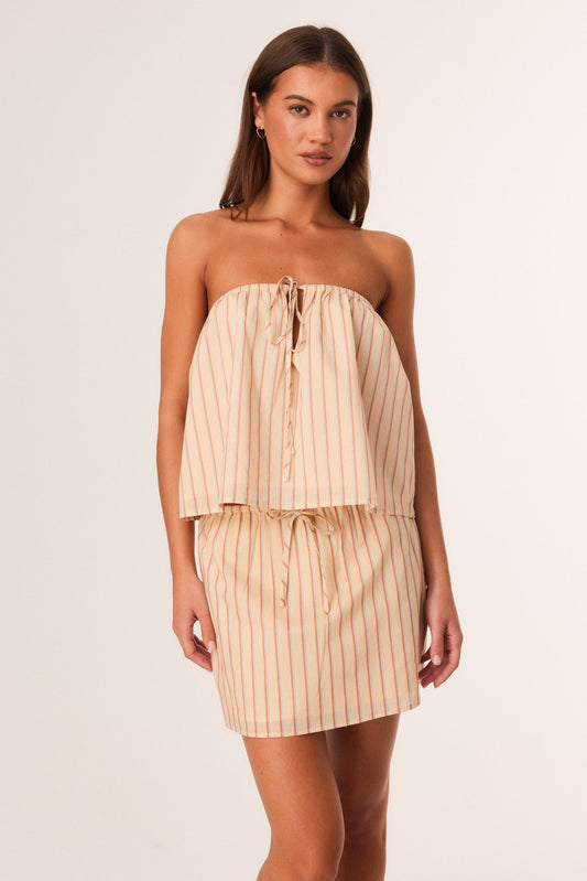 Image of a model wearing Tops. Productname: SNDYS SARA TOP in Butter Stripe colour by brand - SNDYS