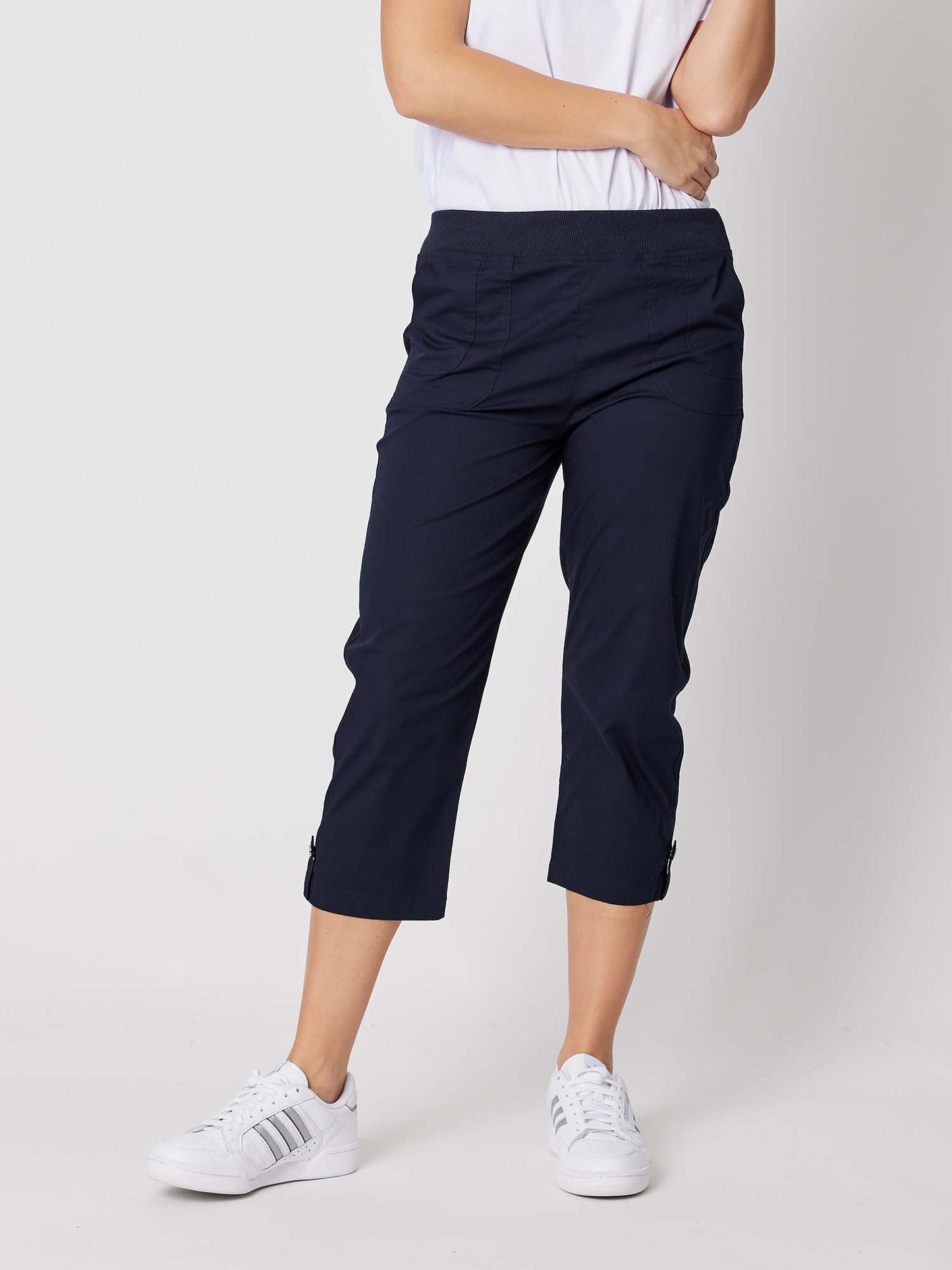 Image of a model wearing Pants. Product name - Santorini Cropped Cotton Pant Navy in Navy colour by brand - Threadz