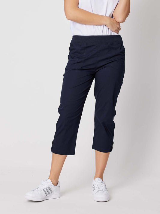 Image of a model wearing Pants. Product name - Santorini Cropped Cotton Pant Navy in Navy colour by brand - Threadz