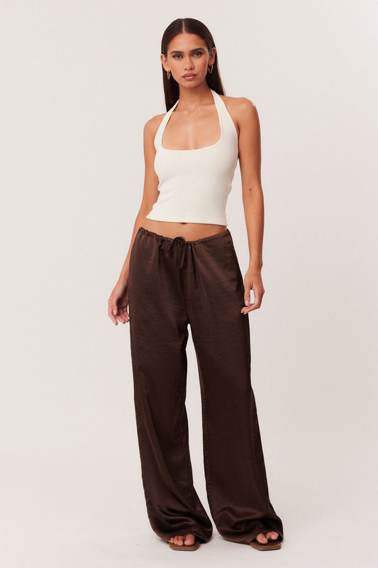 Image of a model wearing Pants. Productname: SNDYS DOVE PANTS 2.0 in Chocolate colour by brand - SNDYS