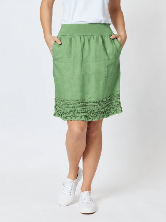 Image of a model wearing Skirts. Product name - Ruffle Hem Skirt Fern in Fern colour by brand - Gordon Smith