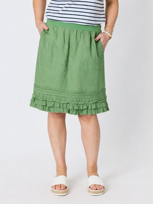Image of a model wearing Skirts. Product name - Ruffle Hem Skirt Fern in Fern colour by brand - Gordon Smith