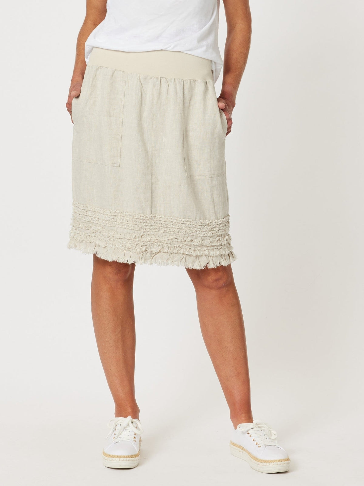 Image of a model wearing Skirts. Product name - Ruffle Hem Skirt Natural in Natural colour by brand - Gordon Smith