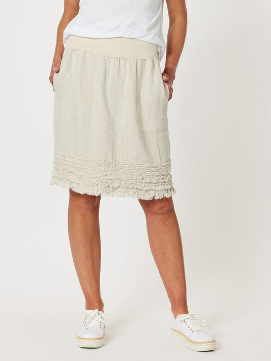 Image of a model wearing Skirts. Product name - Ruffle Hem Skirt Natural in Natural colour by brand - Gordon Smith