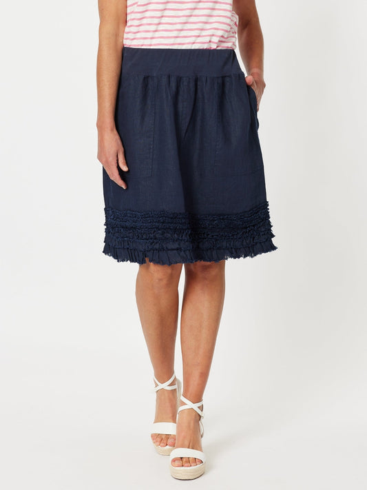 Image of a model wearing Skirts. Product name - Ruffle Hem Skirt Navy in Navy colour by brand - Gordon Smith