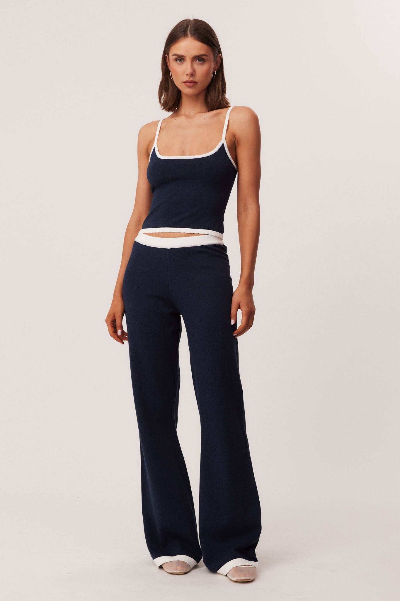 Image of a model wearing Pants. Productname: SNDYS WAVERLY PANTS in Navy colour by brand - SNDYS