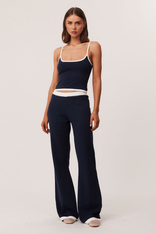 Image of a model wearing Pants. Productname: SNDYS WAVERLY PANTS in Navy colour by brand - SNDYS