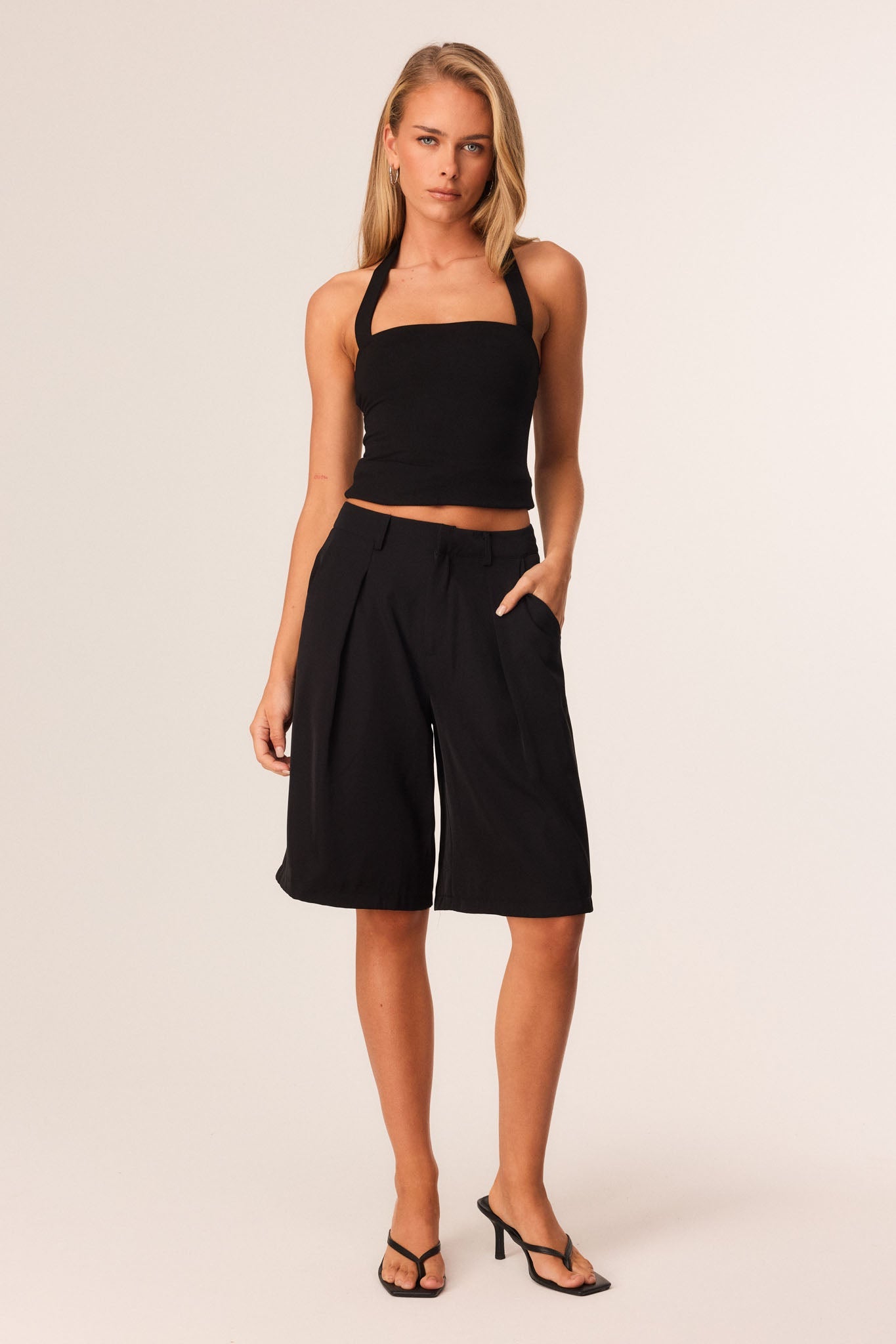 Image of a model wearing Tops. Productname: SNDYS TOMI TOP in Black colour by brand - SNDYS