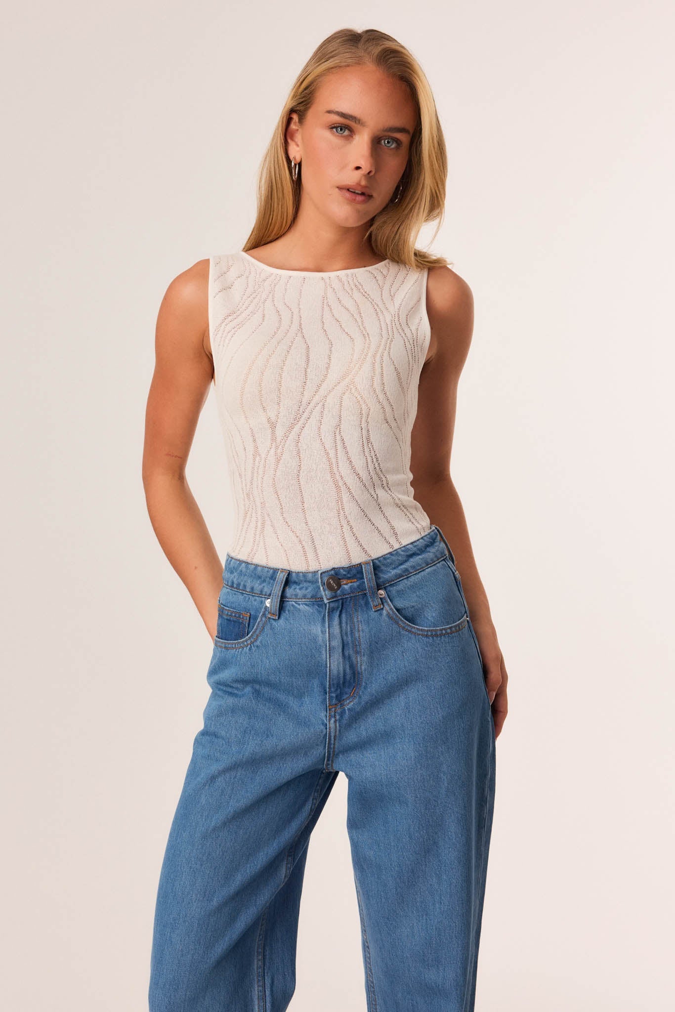 Image of a model wearing Tops. Productname: SNDYS BRANDY TOP in White colour by brand - SNDYS