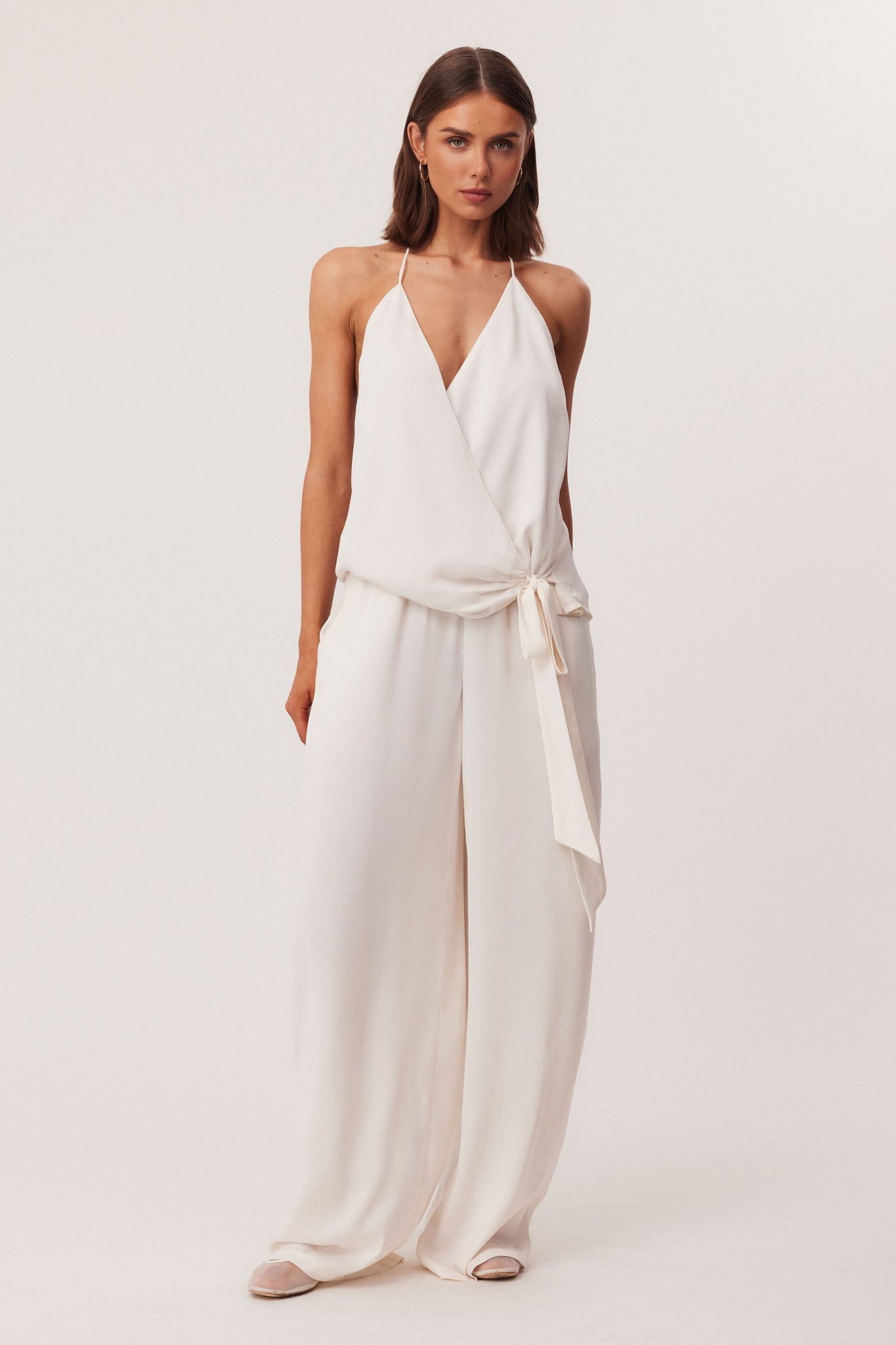 Image of a model wearing Pants. Productname: SNDYS ROSEWOOD PANTS in Off White colour by brand - SNDYS