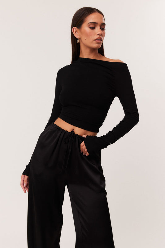 Image of a model wearing Tops. Productname: SNDYS REYNA TOP in Black colour by brand - SNDYS