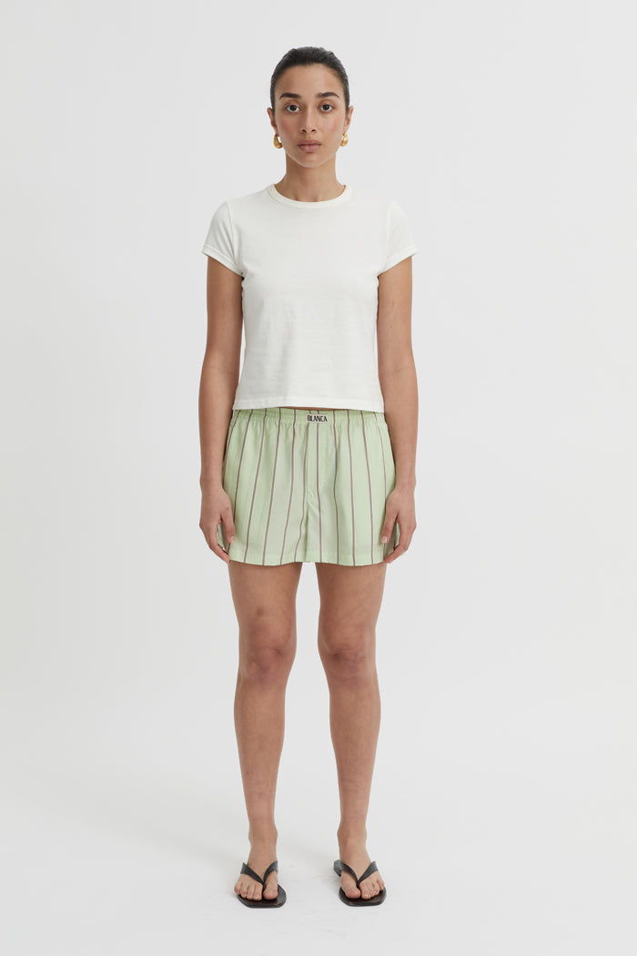 Image of a model wearing Shorts. Product name - Opal Shorts Pistachio in Pistachio colour by brand - Blanca Studio