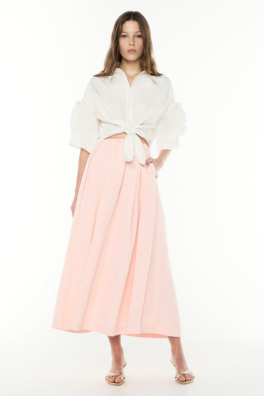 Image of a model wearing Skirts. Productname: The Sweet Life Skirt in PALE PINK colour by brand - Manning Cartell