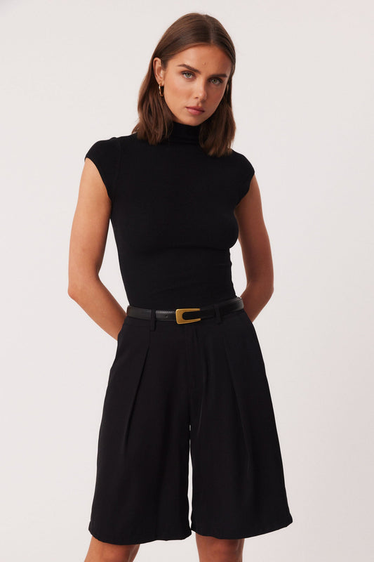 Image of a model wearing Tops. Productname: SNDYS FENIX TOP in Black colour by brand - SNDYS