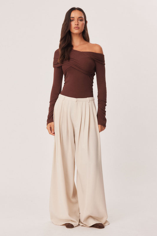 Image of a model wearing Pants. Productname: SNDYS EVELINA PANTS in Bone colour by brand - SNDYS