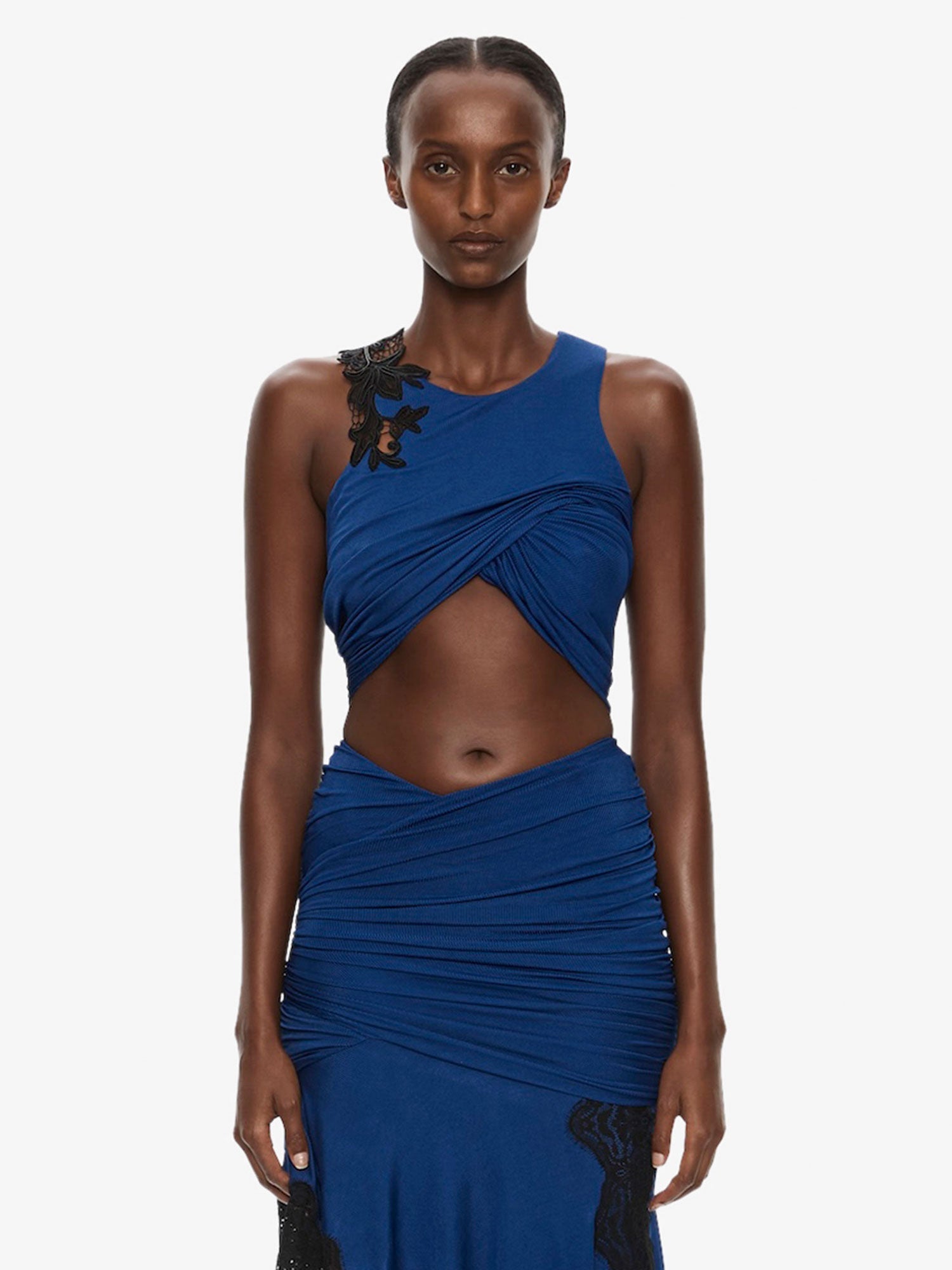 Image of Clothing Tops. Product name - Hibiscus Embroidered Fold Up Tank in Black colour by brand - CHRISTOPHER ESBER