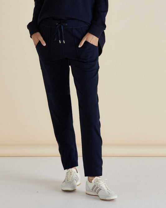 Image of a model wearing Pants. Productname: Betty Basics Noelle Jogger Navy in Navy colour by brand - Betty Basics