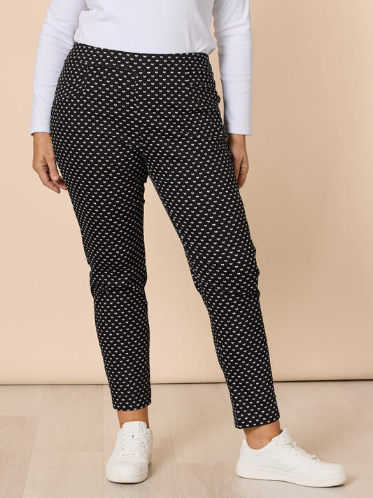 Image of a model wearing Pants. Product name - Pretty Bow Print Pant Black/White in Black/White colour by brand - Gordon Smith