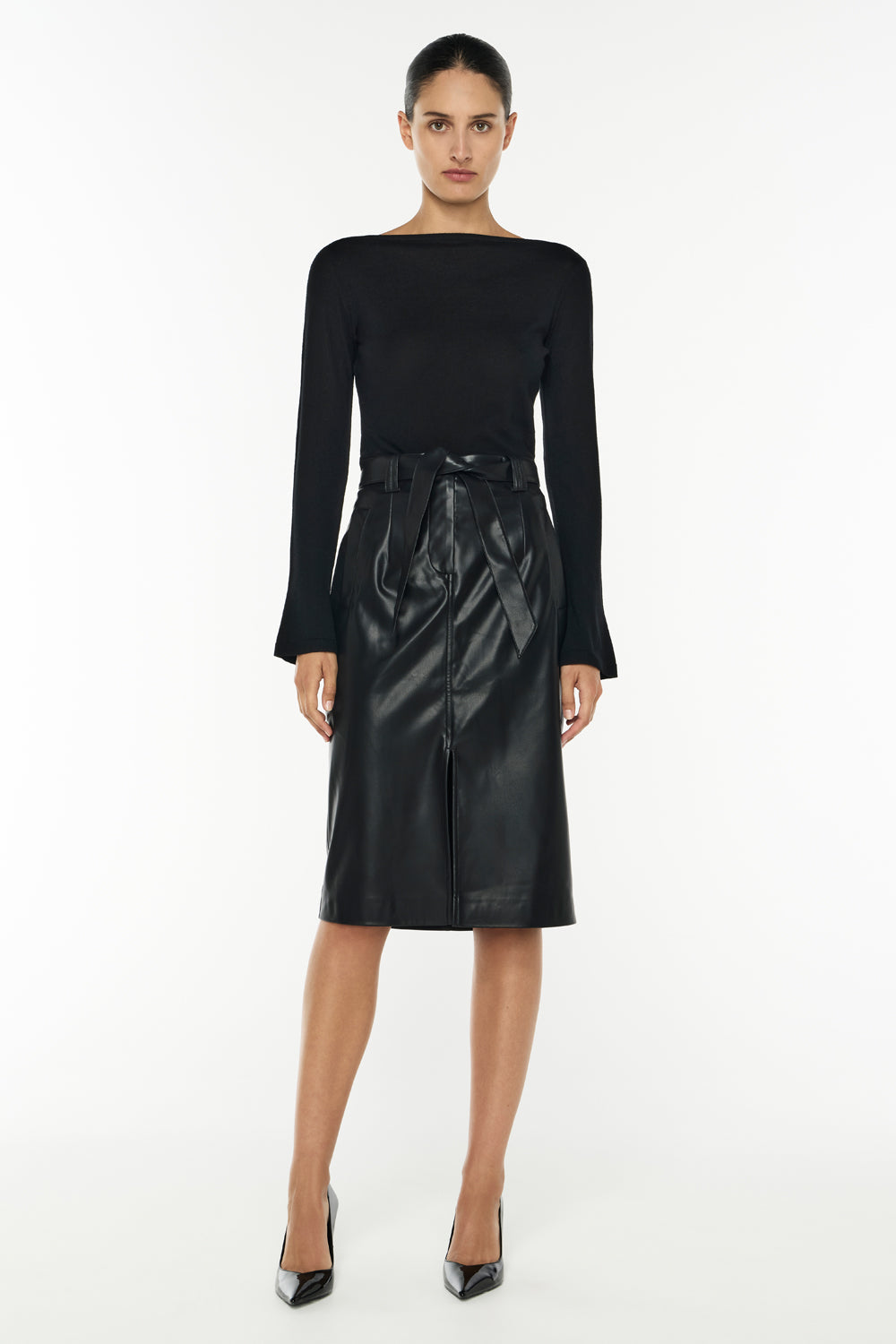 Image of a model wearing Skirts. Productname: Infinite Limits Paperbag Skirt in BLACK colour by brand - Manning Cartell