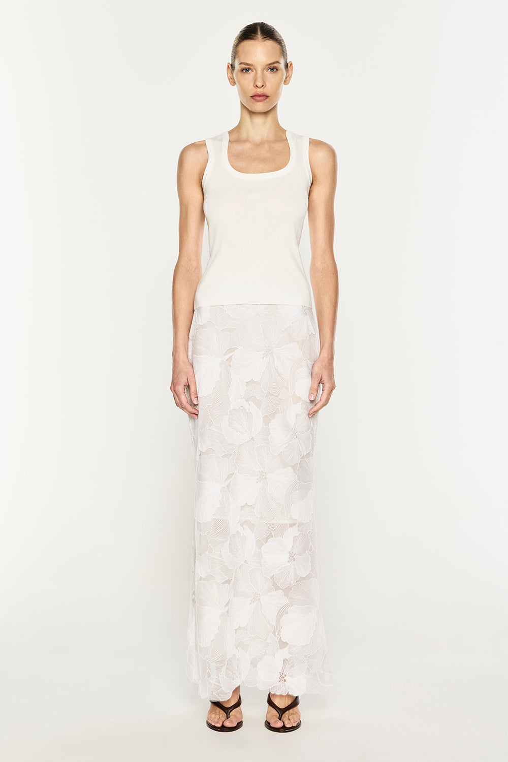 Image of a model wearing Skirts. Product name - Sheer Force Maxi Skirt in White colour by brand - MANNING CARTELL