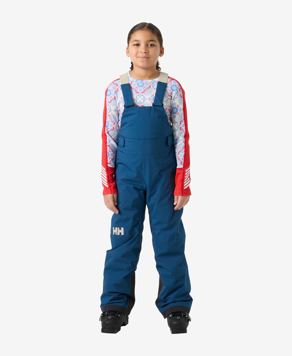 Image of a model wearing Pants. Product name - JR GIRL STELLAR BIB PANT, Dark Blue in Dark Blue colour by brand - Helly Hansen