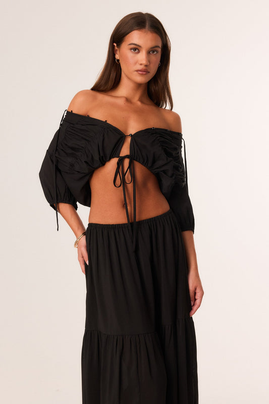 Image of a model wearing Tops. Productname: SNDYS ABBEY TOP in Black colour by brand - SNDYS
