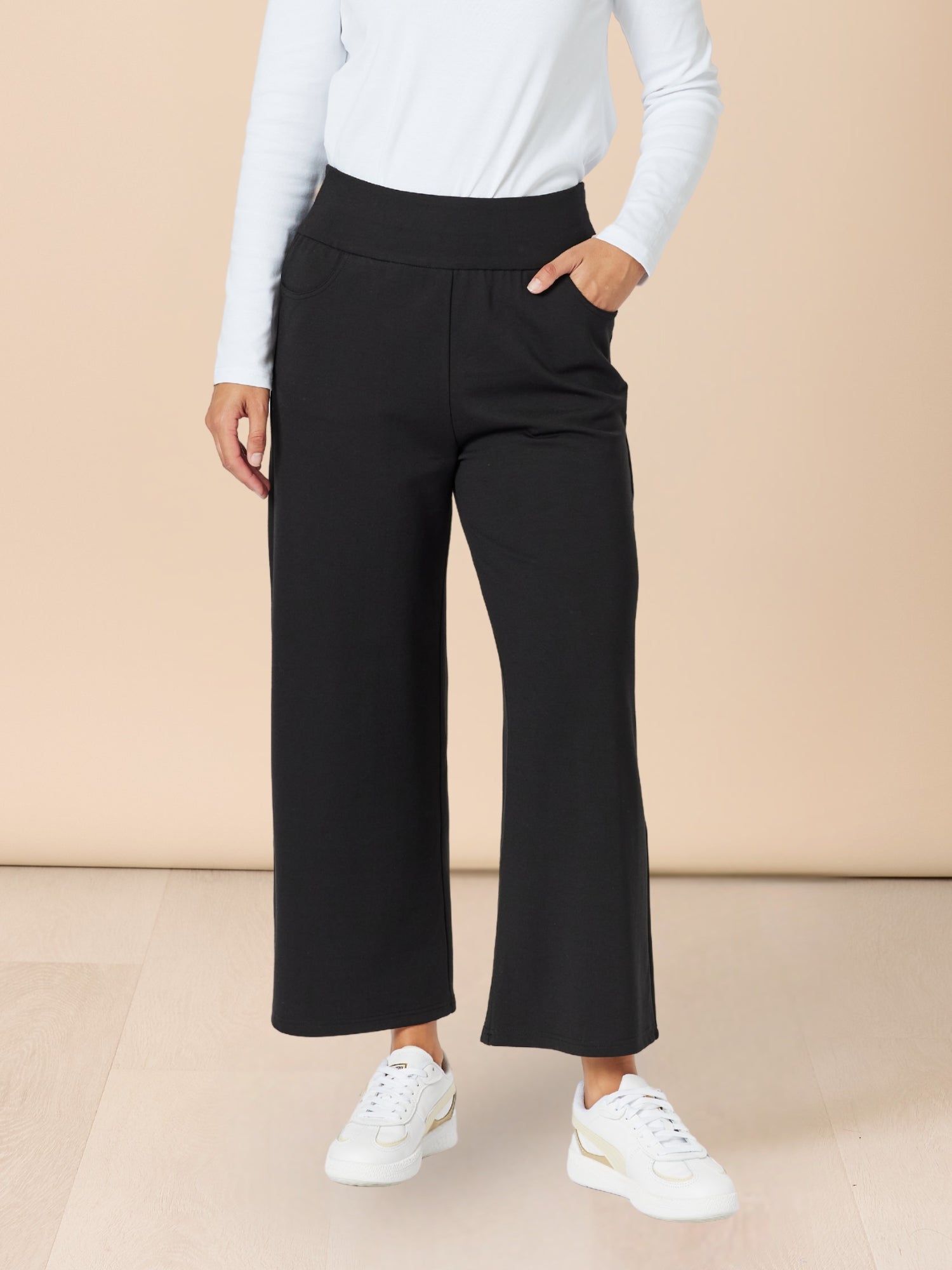 Image of a model wearing Pants. Product name - Kimmy Ponti Wide Leg Pant Black in Black colour by brand - Clarity