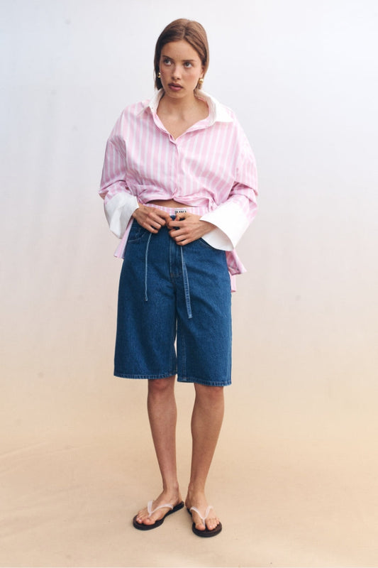 Image of a model wearing Shorts. Product name - Tamsin Shorts Blue in Blue colour by brand - Blanca Studio