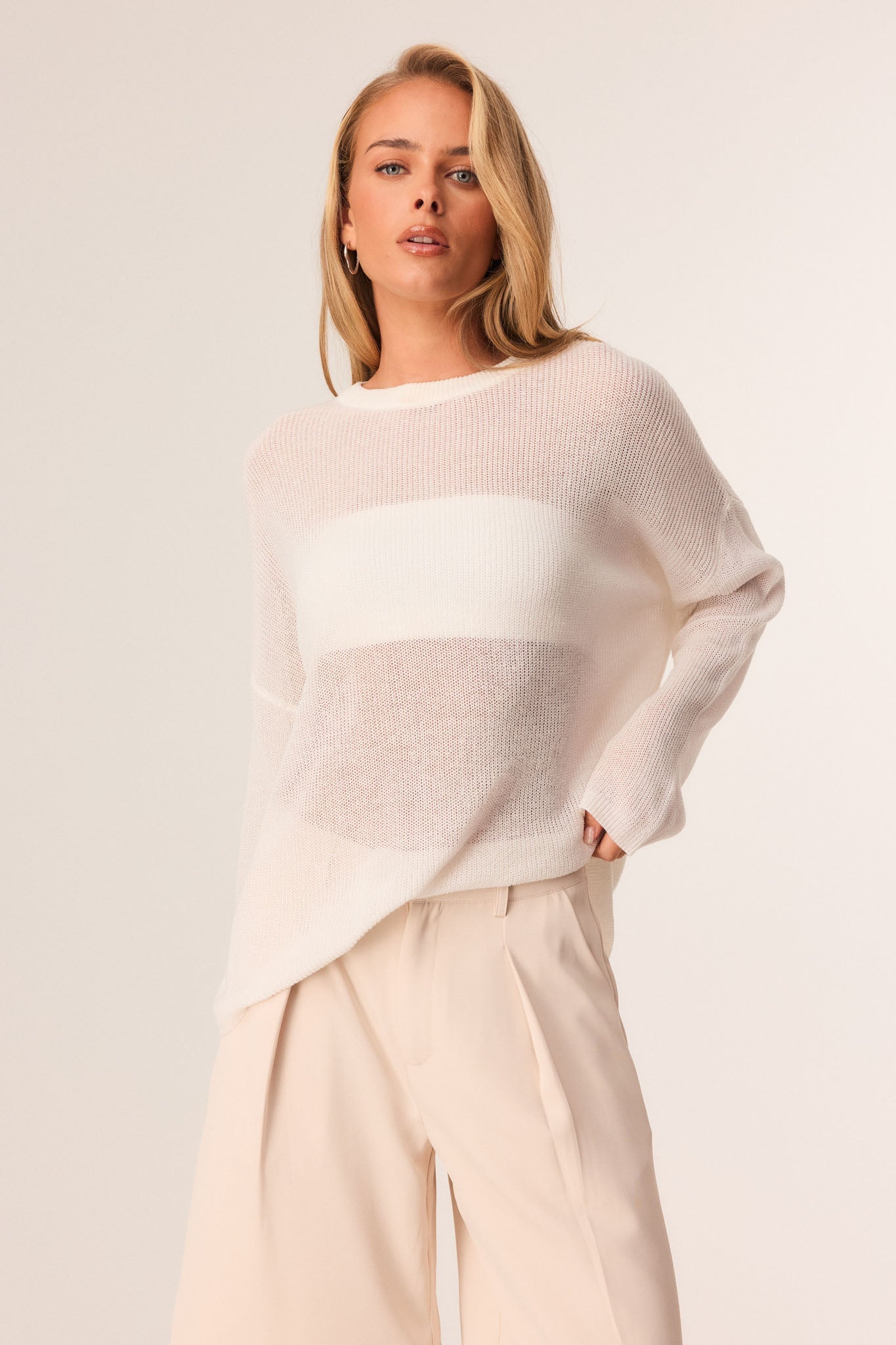 Image of a model wearing Outerwear. Productname: SNDYS BOBBI JUMPER in White colour by brand - SNDYS