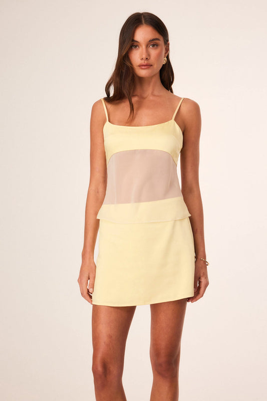 Image of a model wearing Tops. Productname: SNDYS ZOE TOP in Butter colour by brand - SNDYS