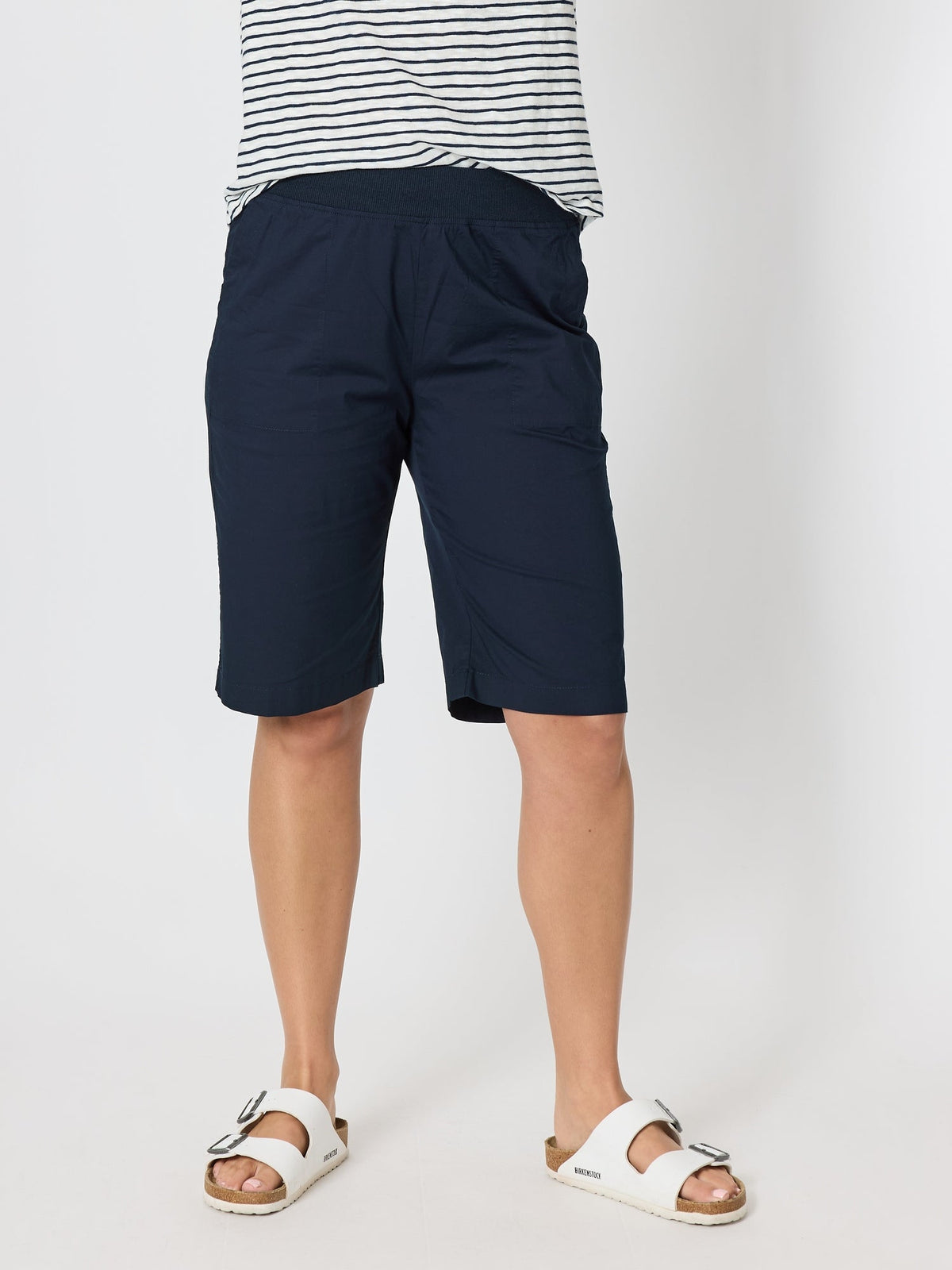 Image of a model wearing Shorts. Product name - Santorini Cotton Pull On Short Navy in Navy colour by brand - Threadz