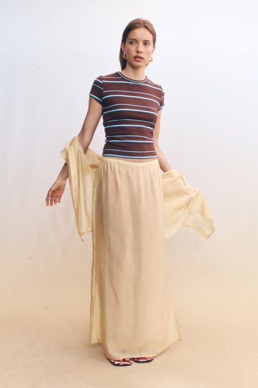 Image of a model wearing Skirts. Product name - Nerina Skirt Butter in Butter colour by brand - Blanca Studio